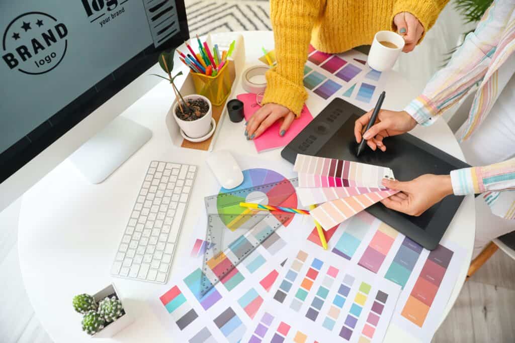Creative designers choosing colour palettes for a design.